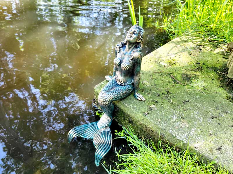 Imposante gusseiserne Figur "Meerjungfrau" Kantenhocker